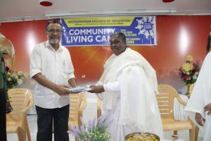 3. BK Laxmiji presented Godly gift to Dr.NK Ramakrishnan - Chairman, Sree Narayana College of Education, Mahe